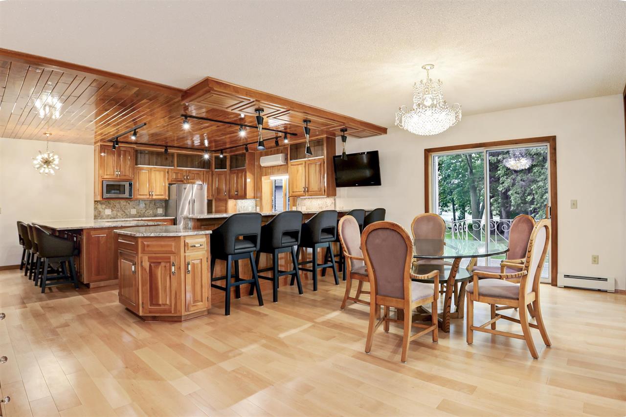 open concept wooden kitchen and dining room with beautiful island countertop Fox Cities